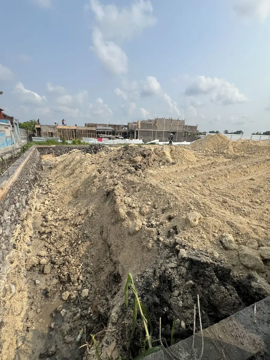 Compacted limestone fill across the parcel